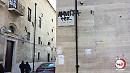 Sulla piazza del Teatro Giordano, la scritta "Amnistia per Cesare Battisti": l'insulto al patriota non assolve il delinquente 